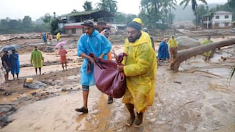 Rescuers carry the body of a victim at the landslide site after multiple landslides in the hills, in Kerala's Wayanad district on July 30, 2024. Source: REUTERS.
