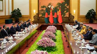 Chinese President Xi Jinping, second from left, and his delegation attend a meeting with Bangladesh Prime Minister Sheikh Hasina, fourth from right, at the Great Hall of the People in Beijing, China, on July 10, 2024. AP