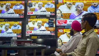 People watch the live telecast of Union Budget 2024-25, being presented by Union Finance Minister Nirmala Sitharaman in the Lok Sabha at a TV showroom, in Amritsar on 23 July. PTI