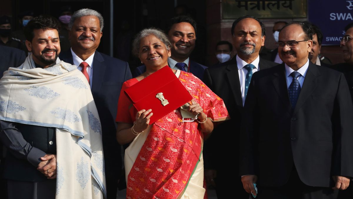 Finance Minister Nirmala Sitharaman holds up a folder with the Government of India logo, as India's Chief Economic Advisor Krishnamurthy Subramanian and Minister of State for Finance and Corporate Affairs Anurag Thakur look on as she leaves her office to present the budget in 2021. File image/Reuters Finance Minister Nirmala Sitharaman holds up a folder with the Government of India logo, as India's Chief Economic Advisor Krishnamurthy Subramanian and Minister of State for Finance and Corporate Affairs Anurag Thakur look on as she leaves her office to present the budget in 2021. File image/Reuters