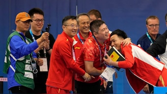 Chinese team celebrates after Huang Yuting and Sheng Lihao won the first gold medal of the Paris Olympics 2024 in the 10m air rifle mixed team event. AP