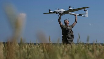 A Ukrainian serviceman launches a mid-range reconnaissance-type drone for flying over Russian troops, in the Kharkiv region, in June. Reuters File
