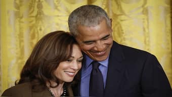 Former US President Barack Obama hugs Vice President Kamala Harris. The two have close ties, but Obama is yet to publicly endorse Harris. File image/AFP