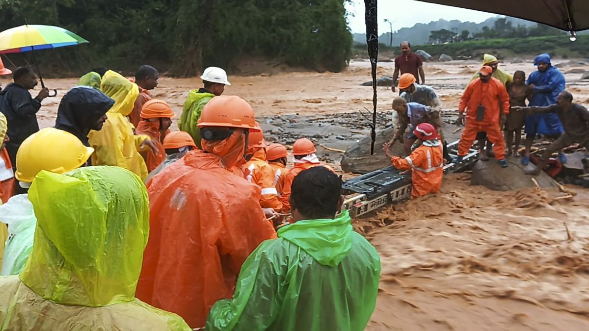 National Disaster Response Force (NDRF) personnel conduct rescue operations after huge landslides in the hilly areas near Meppadi, in Wayanad district, Kerala. PTI National Disaster Response Force (NDRF) personnel conduct rescue operations after huge landslides in the hilly areas near Meppadi, in Wayanad district, Kerala. PTI