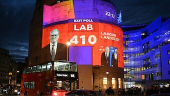 An exit poll predicting the Labour Party led by Keir Starmer will win 410 seats in Britain's general election is projected onto BBC Broadcasting House in London. AFP