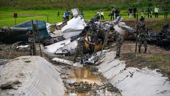 Army personnel clear the debris of a Saurya Airlines' plane after it crashed during takeoff at the Tribhuvan International Airport in Kathmandu. A passenger plane crashed on takeoff in Kathmandu, with the pilot rescued from the flaming wreckage but all 18 others aboard killed. AFP