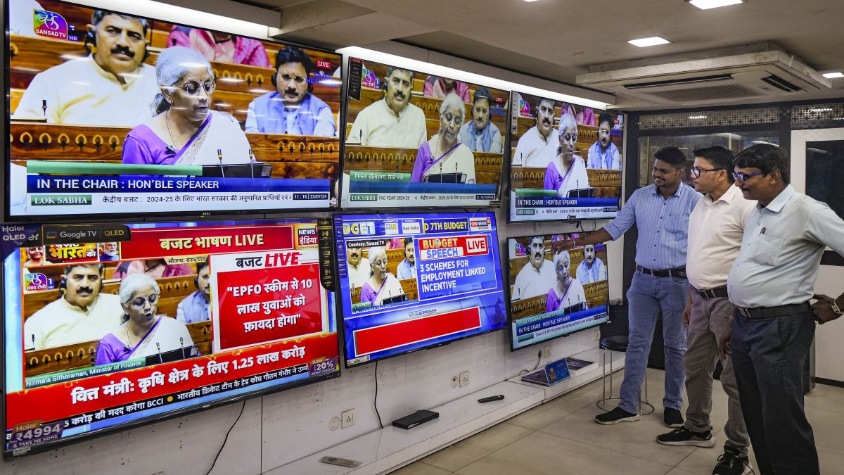People watch the live telecast of Union Budget 2024-25, being presented in the Lok Sabha by Union Finance Minister Nirmala Sitharaman, at a television showroom, in Kolkata. PTI People watch the live telecast of Union Budget 2024-25, being presented in the Lok Sabha by Union Finance Minister Nirmala Sitharaman, at a television showroom, in Kolkata. PTI