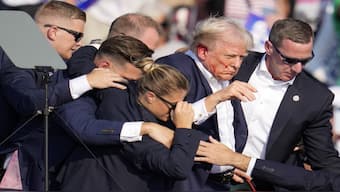Republican presidential candidate former President Donald Trump is helped off the stage by US Secret Service agents at a campaign event in Butler, Pennsylvania. AP