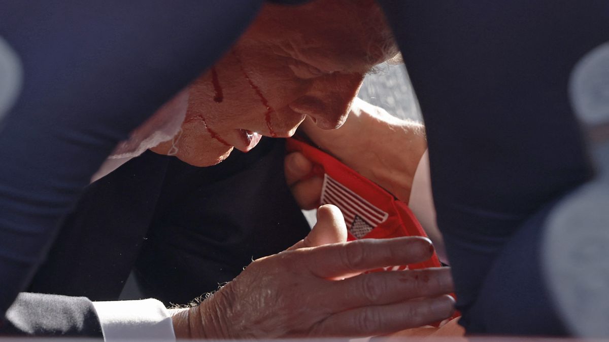 Secret Service tend to US former President Donald Trump onstage at a rally in Butler, Pennsylvania. Butler County district attorney Richard Goldinger said the shooter is dead after killing one audience member and injuring another in the shooting. AFP Secret Service tend to US former President Donald Trump onstage at a rally in Butler, Pennsylvania. Butler County district attorney Richard Goldinger said the shooter is dead after killing one audience member and injuring another in the shooting. AFP