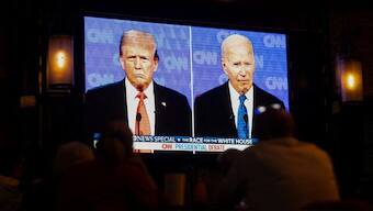 American citizens sit and watch the first presidential debate between Donald Trump and Joe Biden on 27 June. His disaster of a performance prompted many to call on Biden to quit the race, which he finally did on Sunday. File image/Reuters