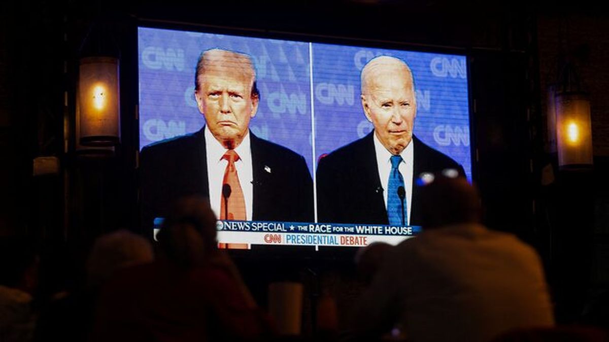 American citizens sit and watch the first presidential debate between Donald Trump and Joe Biden on 27 June. His disaster of a performance prompted many to call on Biden to quit the race, which he finally did on Sunday. File image/Reuters American citizens sit and watch the first presidential debate between Donald Trump and Joe Biden on 27 June. His disaster of a performance prompted many to call on Biden to quit the race, which he finally did on Sunday. File image/Reuters