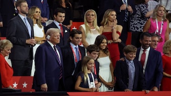 Republican presidential nominee and former US President Donald Trump stands with his family, including his grand children on Day 3 of the Republican National Convention (RNC), at the Fiserv Forum in Milwaukee, Wisconsin. Reuters