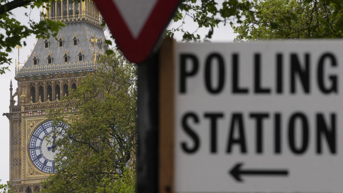 A sign points to where residents can cast their votes in London. File Image/AP A sign points to where residents can cast their votes in London. File Image/AP