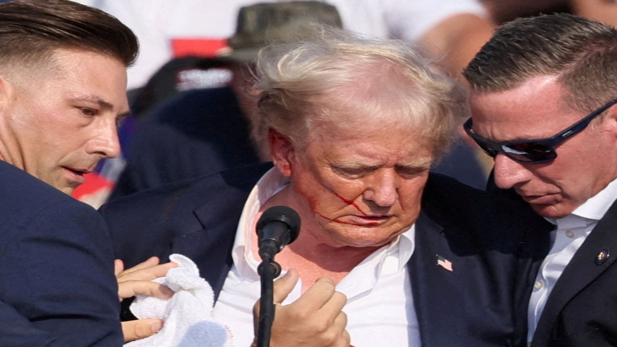 Republican presidential candidate and former US President Donald Trump is assisted by the Secret Service after gunfire rang out during a campaign rally at the Butler Farm Show in Butler, Pennsylvania. Reuters Republican presidential candidate and former US President Donald Trump is assisted by the Secret Service after gunfire rang out during a campaign rally at the Butler Farm Show in Butler, Pennsylvania. Reuters