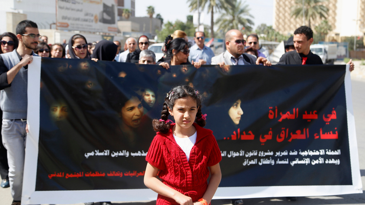 Protesters take part in a demonstration against the draft of the "Al-Jafaari" Personal Status Law during International Women's Day in Baghdad. Reuters Protesters take part in a demonstration against the draft of the "Al-Jafaari" Personal Status Law during International Women's Day in Baghdad. Reuters
