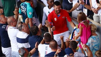 An emotional Novak Djokovic celebrated his Olympic gold medal with his family after the men's singles final in Paris on Sunday. Reuters 