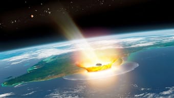 An artist's impression of a large asteroid impacting at Chicxulub on the Mexican coastline, which caused the end-Cretaceous mass extinction, 66 million years ago, with the planet Mars and asteroid bodies in the background, in this image obtained by Reuters on August 14, 2024. Reuters