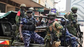 Police officers react as Ugandan activists participate in a demonstration over proposed plans by Total Energies and the Ugandan government to build the East African Crude Oil Pipeline (EACOP) in Kampala, Uganda. Reuters