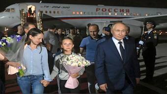 President Vladimir Putin meets convicted Russian spies released as part of a prisoners' swap at Vnukovo International Airport in Moscow. AP