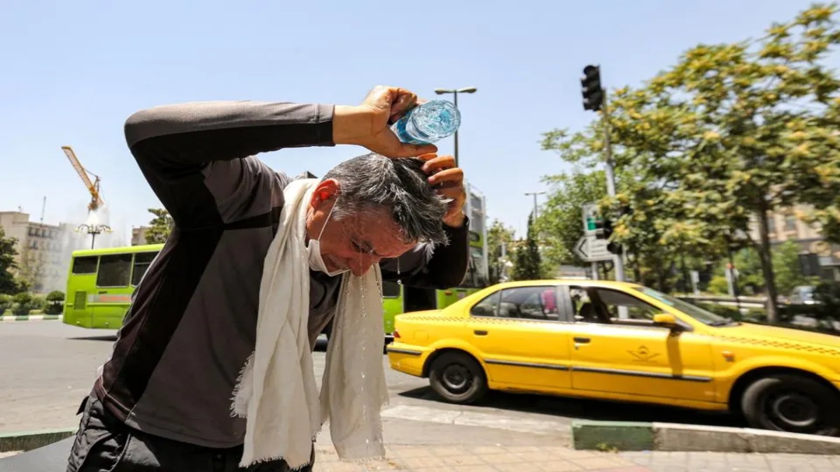 A man pours water on his head from a bottle to cool off during a heatwave in Tehran in July 2023. File Image: AFP A man pours water on his head from a bottle to cool off during a heatwave in Tehran in July 2023. File Image: AFP