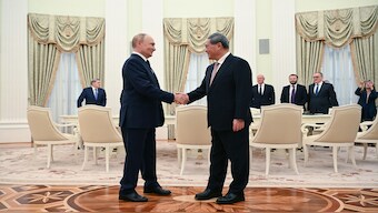 Russian President Vladimir Putin and Chinese Premier Li Qiang shake hands during their meeting at the Kremlin in Moscow, Russia. AP