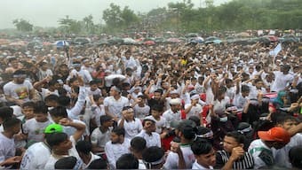 Hundreds of Rohingyas gather in the rain to demand safe return to Myanmar's Rakhine state as they mark the seventh anniversary of their mass exodus from Myanmar at their refugee camp at Kutupalong in Cox's Bazar district, Bangladesh. AP