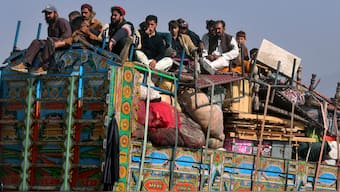 (File) Afghan families onboard a truck head toward a border crossing point in Torkham, Pakistan on October 31, 2023. AP