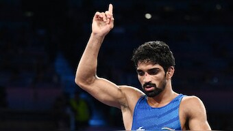 India's Aman Sehrawat celebrates his victory over Puerto Rico's Darian Cruz in the men's 57kg bronze medal match. Reuters