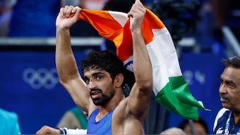 India's Aman Sehrawat celebrates after defeating Puerto Rico's Darian Cruz to win bronze in the mens 57kg event. Reuters