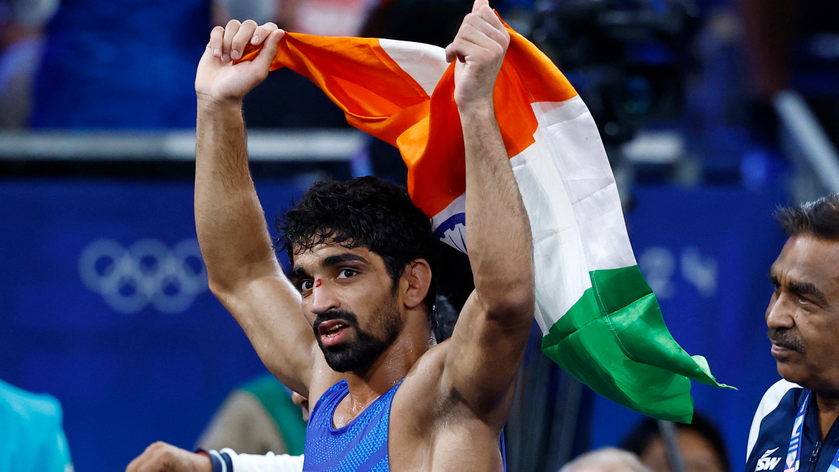 India's Aman Sehrawat celebrates after defeating Puerto Rico's Darian Cruz to win bronze in the mens 57kg event. Reuters India's Aman Sehrawat celebrates after defeating Puerto Rico's Darian Cruz to win bronze in the mens 57kg event. Reuters