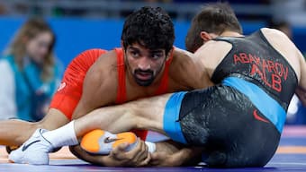 India's Aman Sehrawat competes against Albania's Russian-born grappler Zelimkhan Abakarov during the men's 57kg wrestling quarter-finals in the Paris Olympics. AP