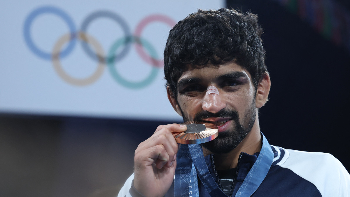 Aman Sehrawat poses with the bronze medal that he won in the Paris Olympics men's 57kg wrestling event. Reuters Aman Sehrawat poses with the bronze medal that he won in the Paris Olympics men's 57kg wrestling event. Reuters