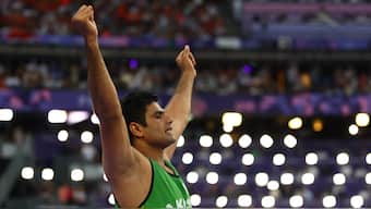 Pakistan's Arshad Nadeem raises his arms in celebration after smashing the Olympic record during the men's javelin final in the Paris Olympics. Reuters