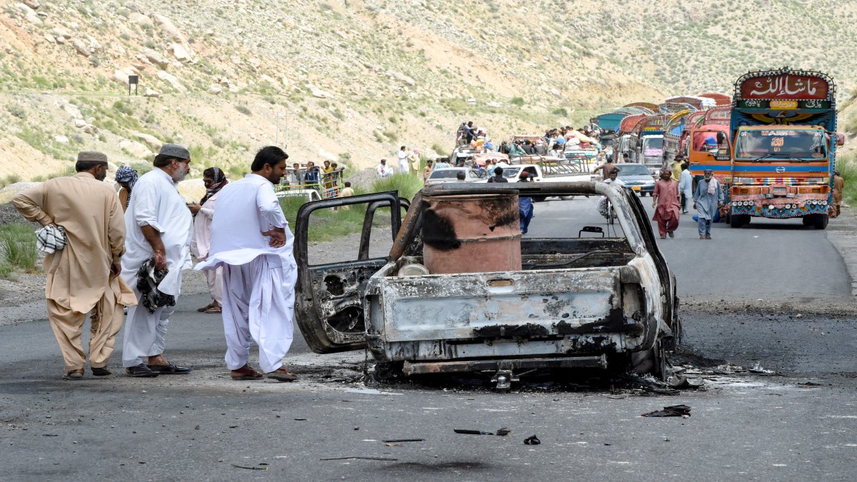 People look at a charred vehicle near a collapsed railway bridge the morning after a blast by separatist militants at Kolpur in Bolan district, Balochistan province. AFP People look at a charred vehicle near a collapsed railway bridge the morning after a blast by separatist militants at Kolpur in Bolan district, Balochistan province. AFP