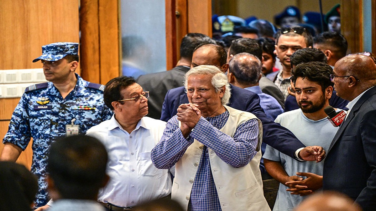 Nobel laureate Muhammad Yunus (C) greets journalists as he arrives for the press conference at the Hazrat Shahjalal International Airport in Dhaka on August 8, 2024. Image: Munir Uz Zaman / AFP Nobel laureate Muhammad Yunus (C) greets journalists as he arrives for the press conference at the Hazrat Shahjalal International Airport in Dhaka on August 8, 2024. Image: Munir Uz Zaman / AFP