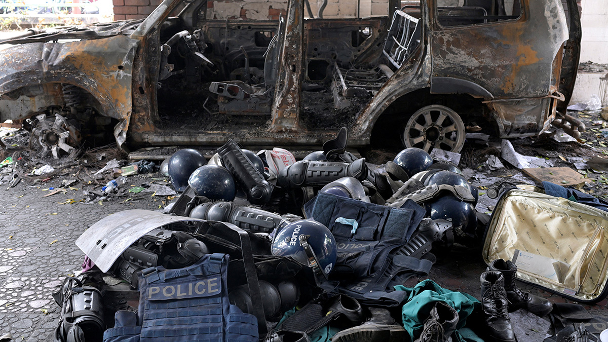 (File) Damaged riot gear of security forces is seen next to a burnt vehicle outside a police station, days after the resignation of former Bangladeshi prime minister Sheikh Hasina, in Dhaka, Bangladesh, on August 8, 2024. Reuters (File) Damaged riot gear of security forces is seen next to a burnt vehicle outside a police station, days after the resignation of former Bangladeshi prime minister Sheikh Hasina, in Dhaka, Bangladesh, on August 8, 2024. Reuters