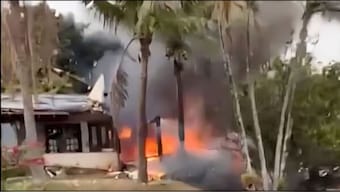 This enhanced frame grab from video shows fire coming from a plane that crashed by a home in Vinhedo, Sao Paulo state, Brazil. AP
