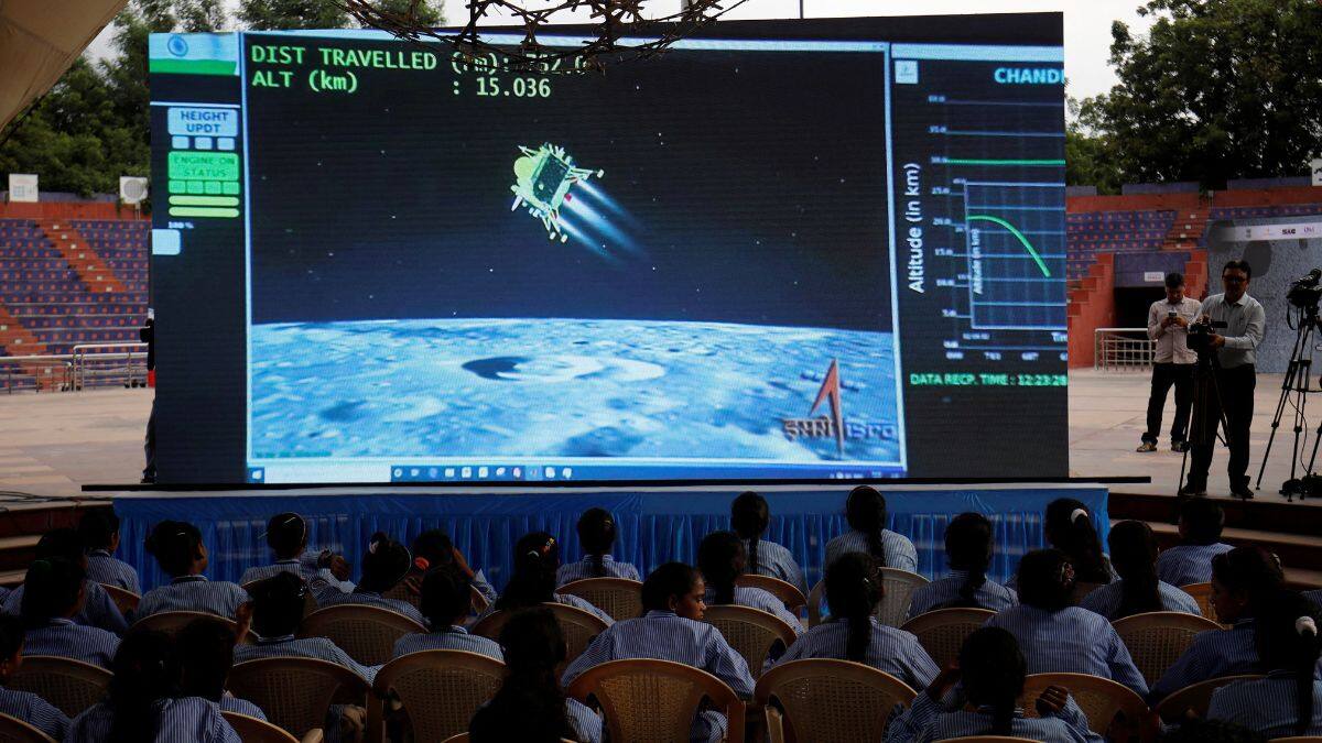 People watch a live stream of Chandrayaan-3 spacecraft's landing on the moon, inside an auditorium of Gujarat Science City in Ahmedabad, India, August 23, 2023. File Image/Reuters