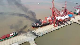 This image shared on Chinese social media and carried by state media outlets on August 9 shows the aftermath of a shipping container explosion on a cargo ship moored at Ningbo Zhoushan Port in China's eastern Zhejiang province. X
