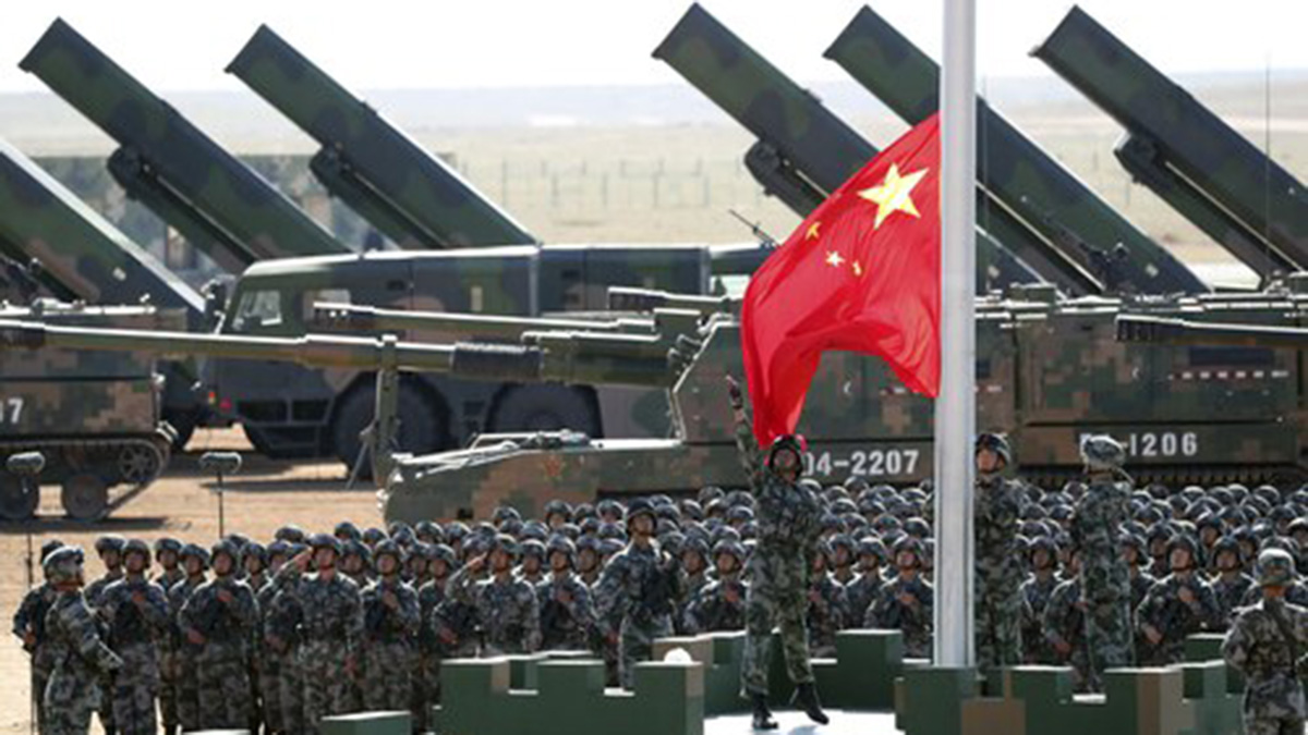 (File) Chinese People's Liberation Army (PLA) troops perform a flag raising ceremony. AP (File) Chinese People's Liberation Army (PLA) troops perform a flag raising ceremony. AP