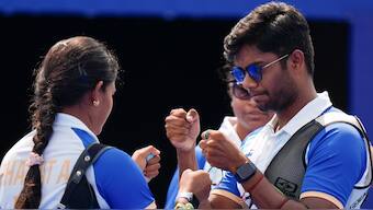 India's Ankita Bhakat and Dhiraj Bommadevara celebrate during their mixed team archery quarter-final meeting with Spain at the Paris Olympics. AP