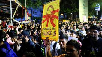 A medical student carries a placard, as he walks along with doctors and paramedics to join a protest against what they say is rape and murder of a trainee doctor, inside the premises of R G Kar Medical College and Hospital in Kolkata, India, August 12, 2024. Source: REUTERS.
