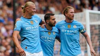 Erling Haaland celebrates with teammates after scoring Manchester City's first goal in their season-opening game against Chelsea in the Premier League. AP