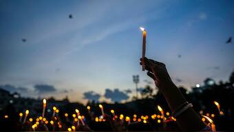 Kolkata medic's rape-murder: Women hold candles as they stage a protest against the rape and killing of a trainee doctor at a government hospital last week, in Guwahati, India, Friday, Aug. 16, 2024. (AP Photo)