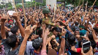 Protesters carry a member of the army on their shoulders as they celebrate Prime Minister Sheikh Hasina's resignation, in Dhaka, Bangladesh, Monday, Aug. 5, 2024. File Image/ AP