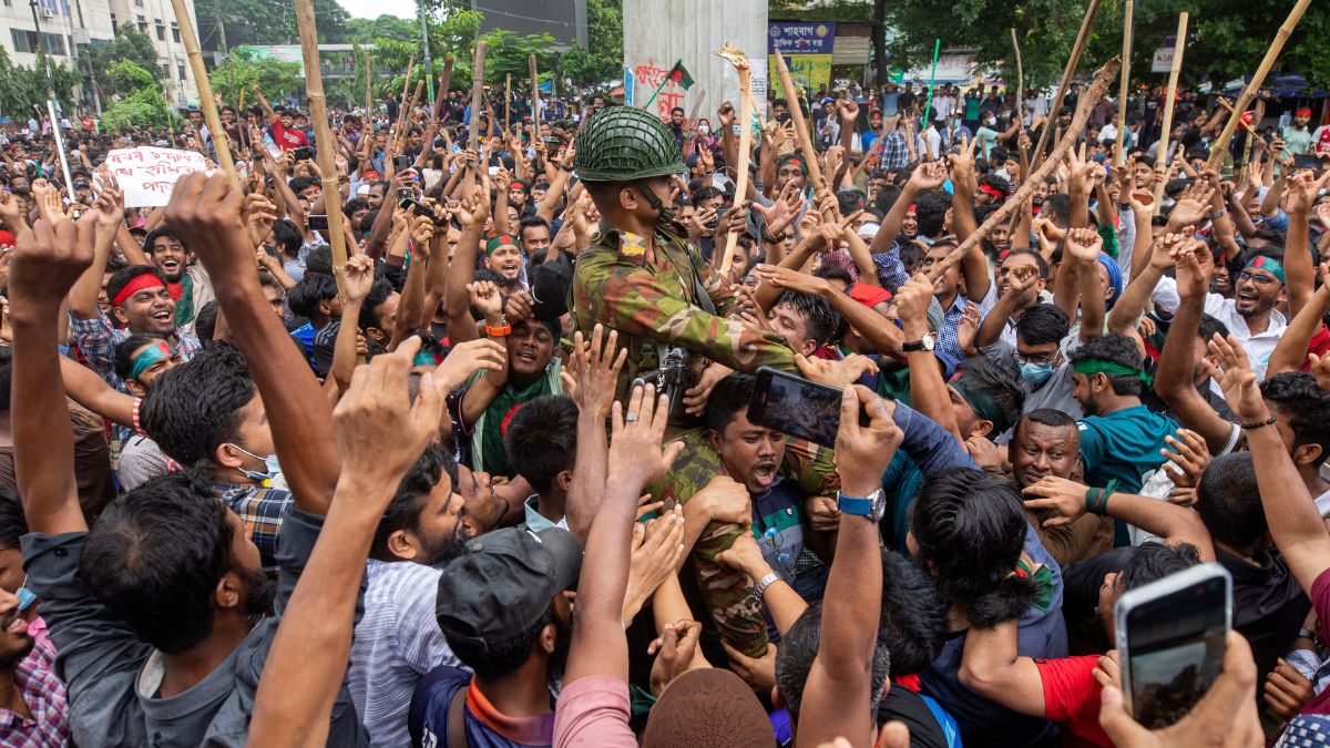 Protesters carry a member of the army on their shoulders as they celebrate Prime Minister Sheikh Hasina's resignation, in Dhaka, Bangladesh, Monday, Aug. 5, 2024. File Image/ AP Protesters carry a member of the army on their shoulders as they celebrate Prime Minister Sheikh Hasina's resignation, in Dhaka, Bangladesh, Monday, Aug. 5, 2024. File Image/ AP