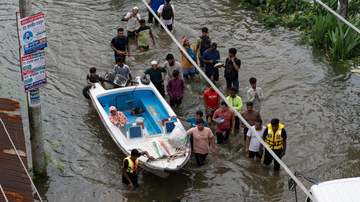 People bring a speed boat to rescue stranded residents in a flooded area of Feni, a coastal district in southeast Bangladesh, Friday, Aug. 23, 2024. Reuters People bring a speed boat to rescue stranded residents in a flooded area of Feni, a coastal district in southeast Bangladesh, Friday, Aug. 23, 2024. Reuters