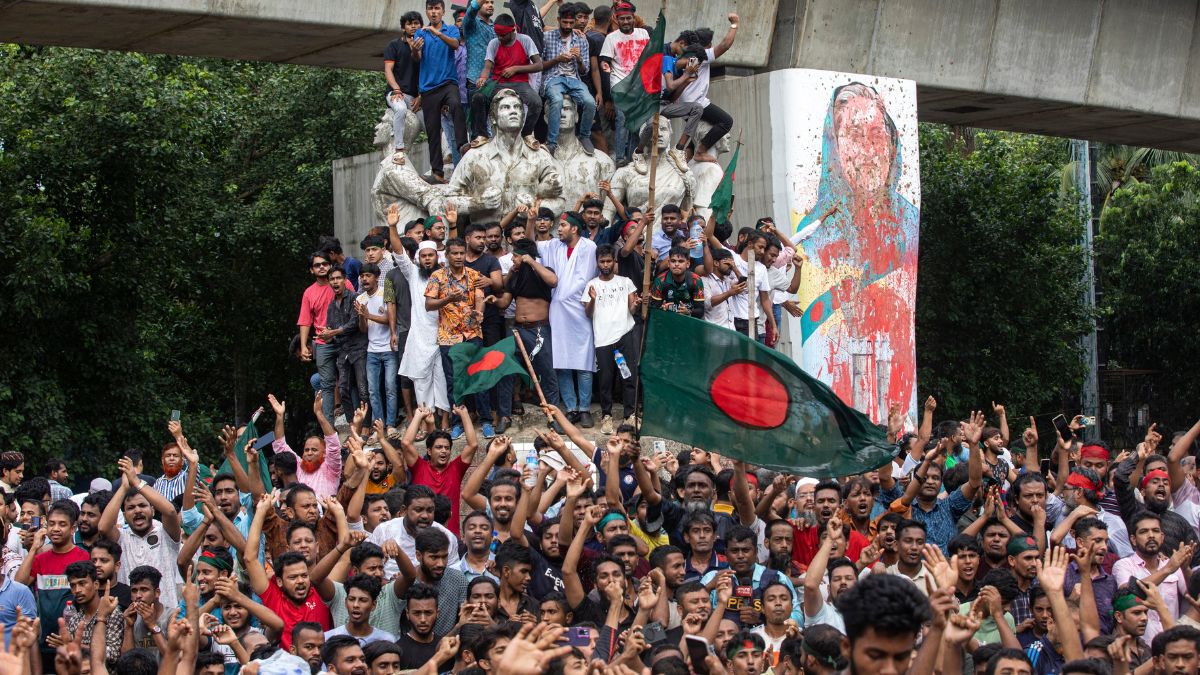 Protesters climb a public monument as they celebrate after getting the news of Prime Minister Sheikh Hasina's resignation, in Dhaka, Bangladesh, Monday, Aug. 5, 2024. File Image: AP Protesters climb a public monument as they celebrate after getting the news of Prime Minister Sheikh Hasina's resignation, in Dhaka, Bangladesh, Monday, Aug. 5, 2024. File Image: AP