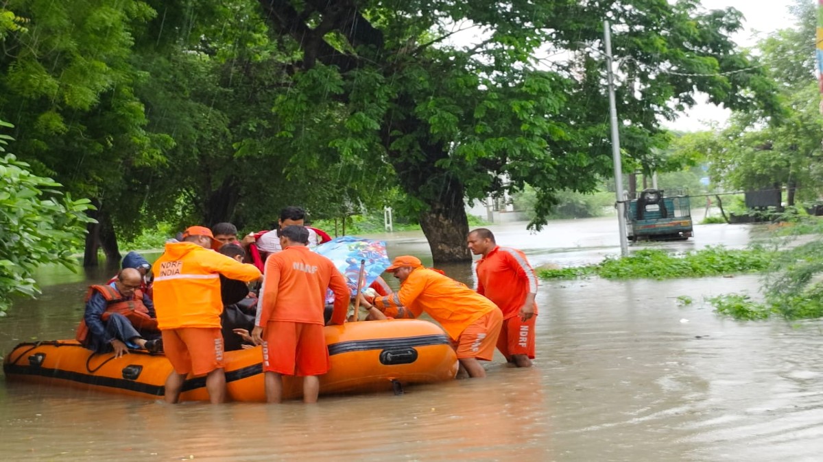In the two states most severely affected, Vadodara (8,361) and Panchmahals (4,000), more than 12,000 people were relocated on Tuesday. Image Courtesy: @06NDRF/X In the two states most severely affected, Vadodara (8,361) and Panchmahals (4,000), more than 12,000 people were relocated on Tuesday. Image Courtesy: @06NDRF/X