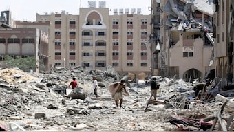 Palestinians inspect damage in Qatari-funded Hamad City, following an Israeli raid, amid the ongoing conflict between Israel and Hamas, in Khan Younis, in the southern Gaza Strip, on August 24, 2024. Reuters File